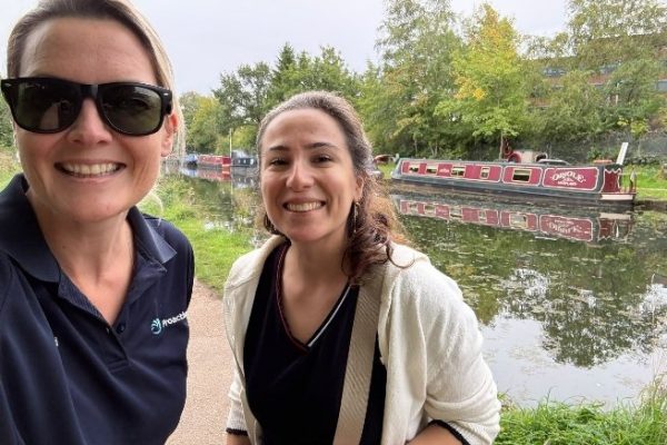 Two Proactive colleagues taking a selfie on a canal towpath with narrowboats behind