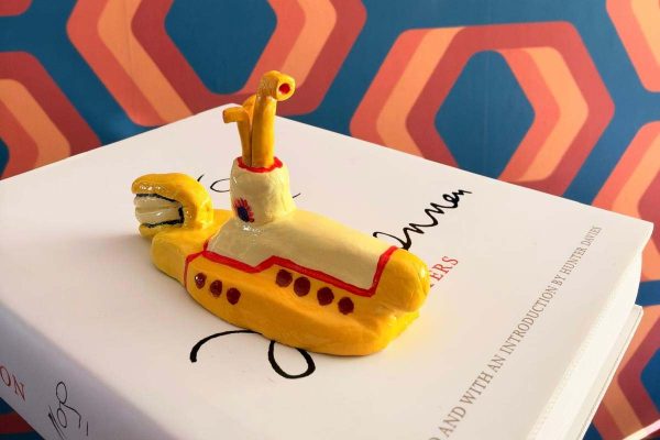Aaron's clay submarine, painted yellow with red trim and portholes